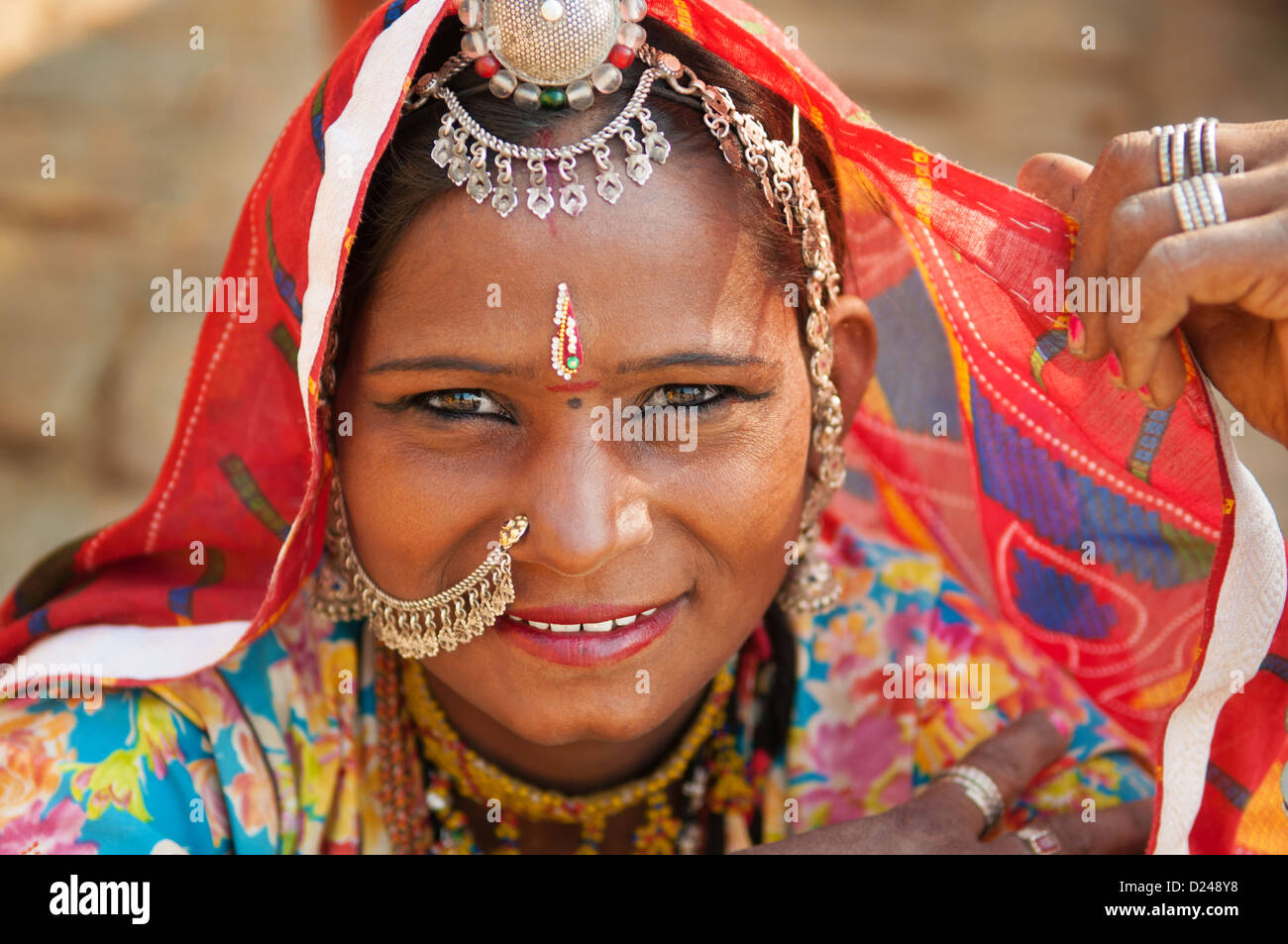 Beautiful Traditional Indian woman in sari costume covered her head with veil, India Stock Photo