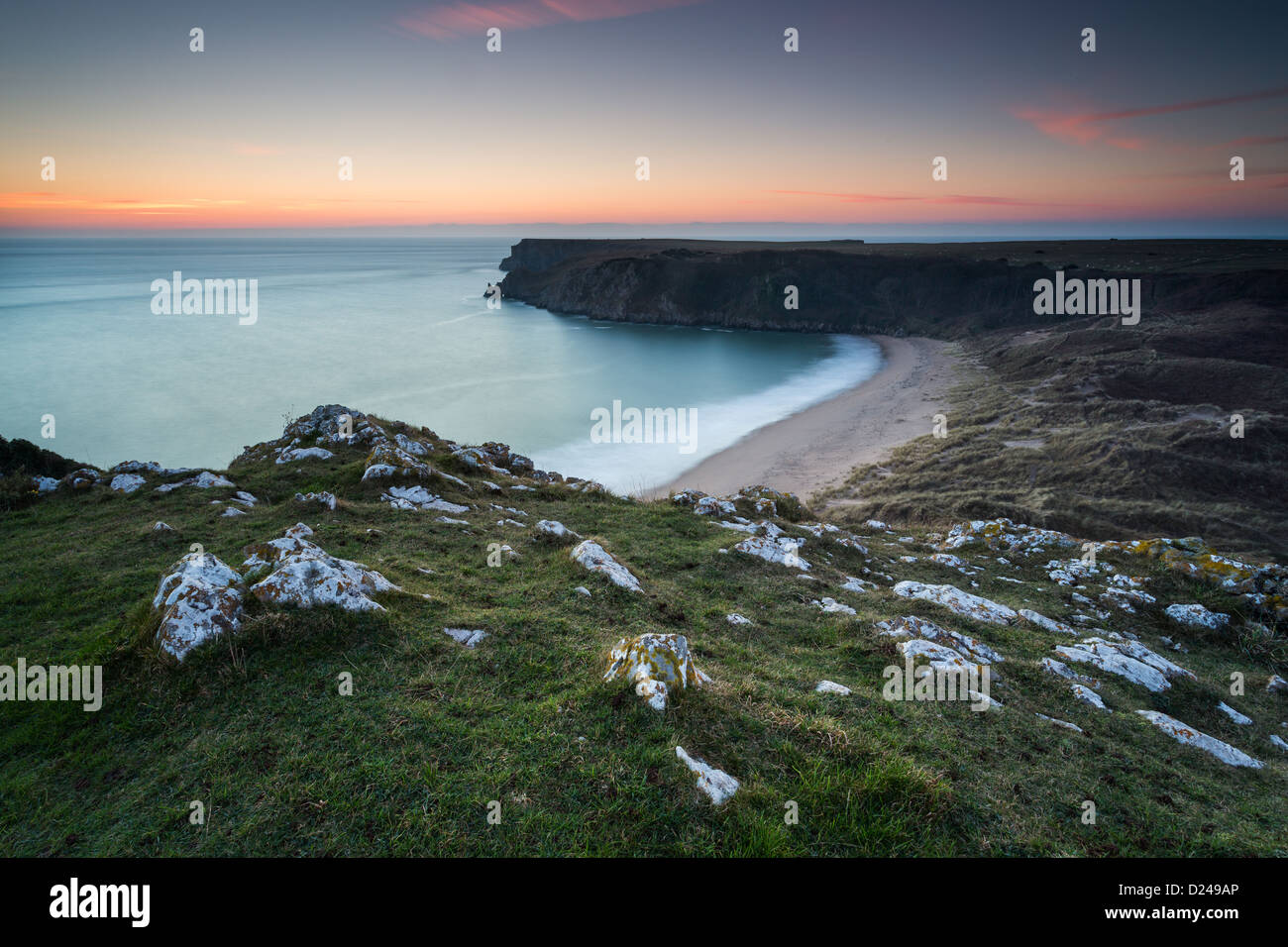 Barafundle Bay in Pembrokeshire, Wales. Winter sunset over the golden beach and sand dunes. Stock Photo