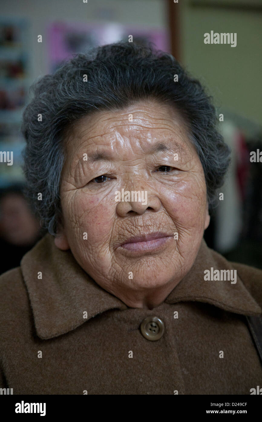 portrait of an old South Korean woman photographed in senior center Stock Photo