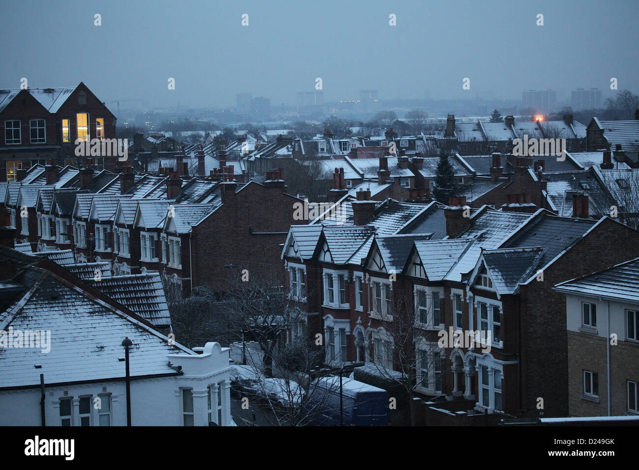 London, UK. 14th January 2013. Acton Snow settling on London rooftops. Credit:  Sebastian Remme / Alamy Live News Stock Photo