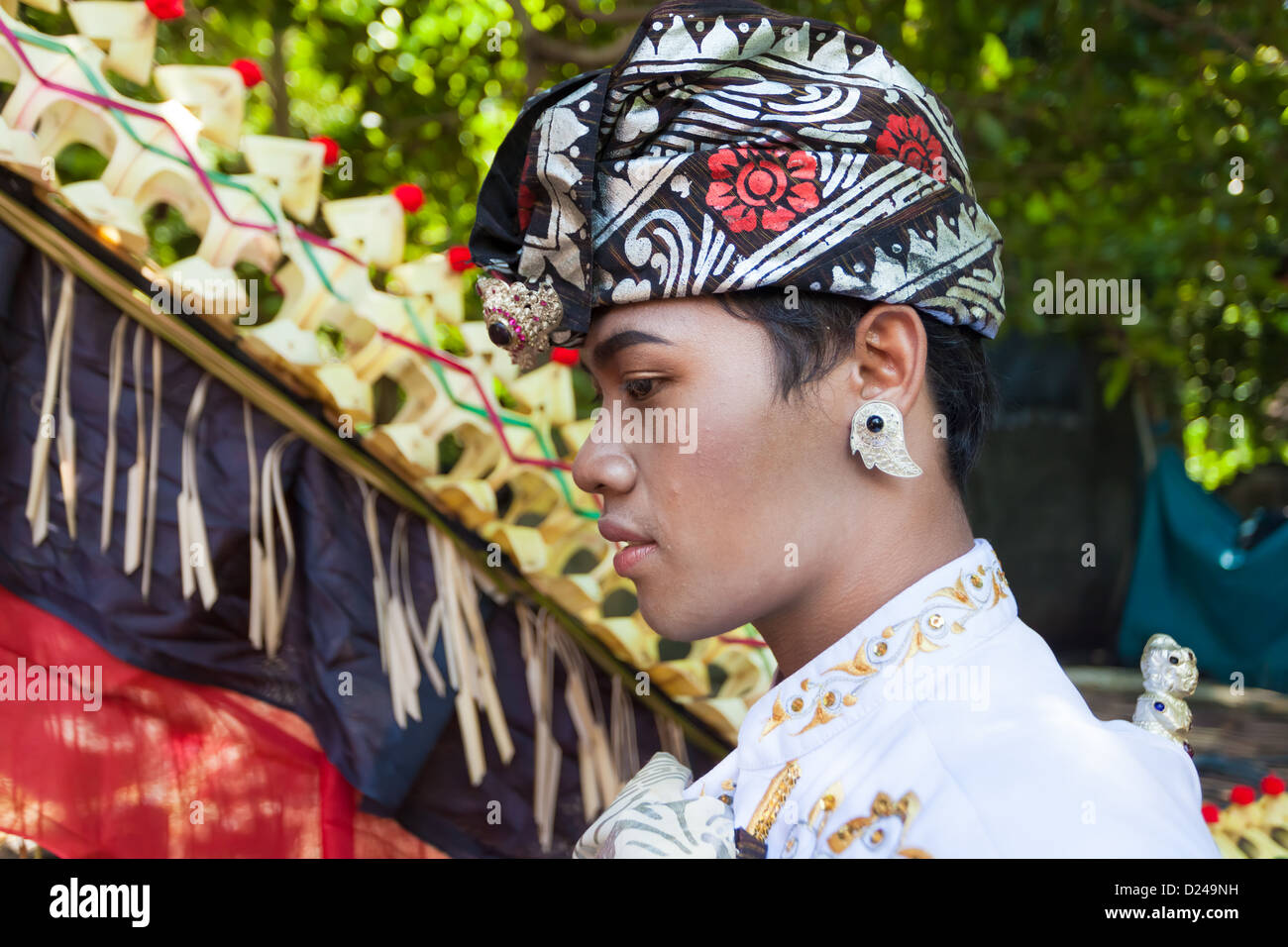 BALI - FEBRUARY 11. Man enacting wedding scene in preparation for religious ceremony on February 11, 2012 in Bali, Indonesia. Stock Photo