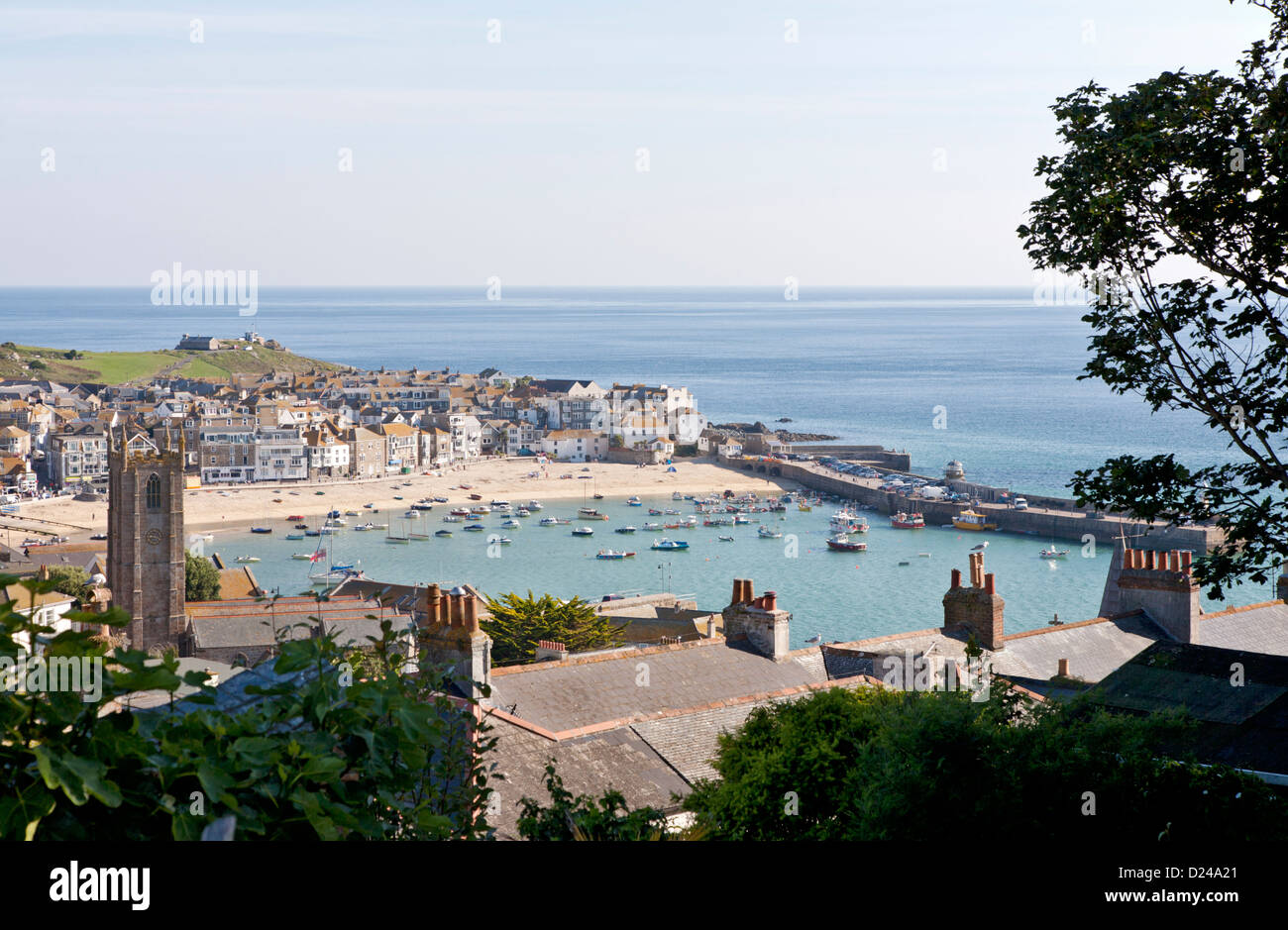 St Ives harbour viewed over rooftops with the tide in. Cornwall UK Stock Photo
