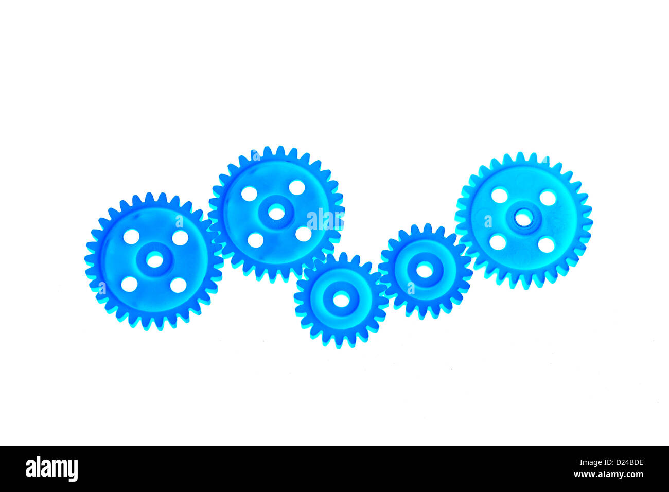 Close up of plastic gear wheels on white background Stock Photo