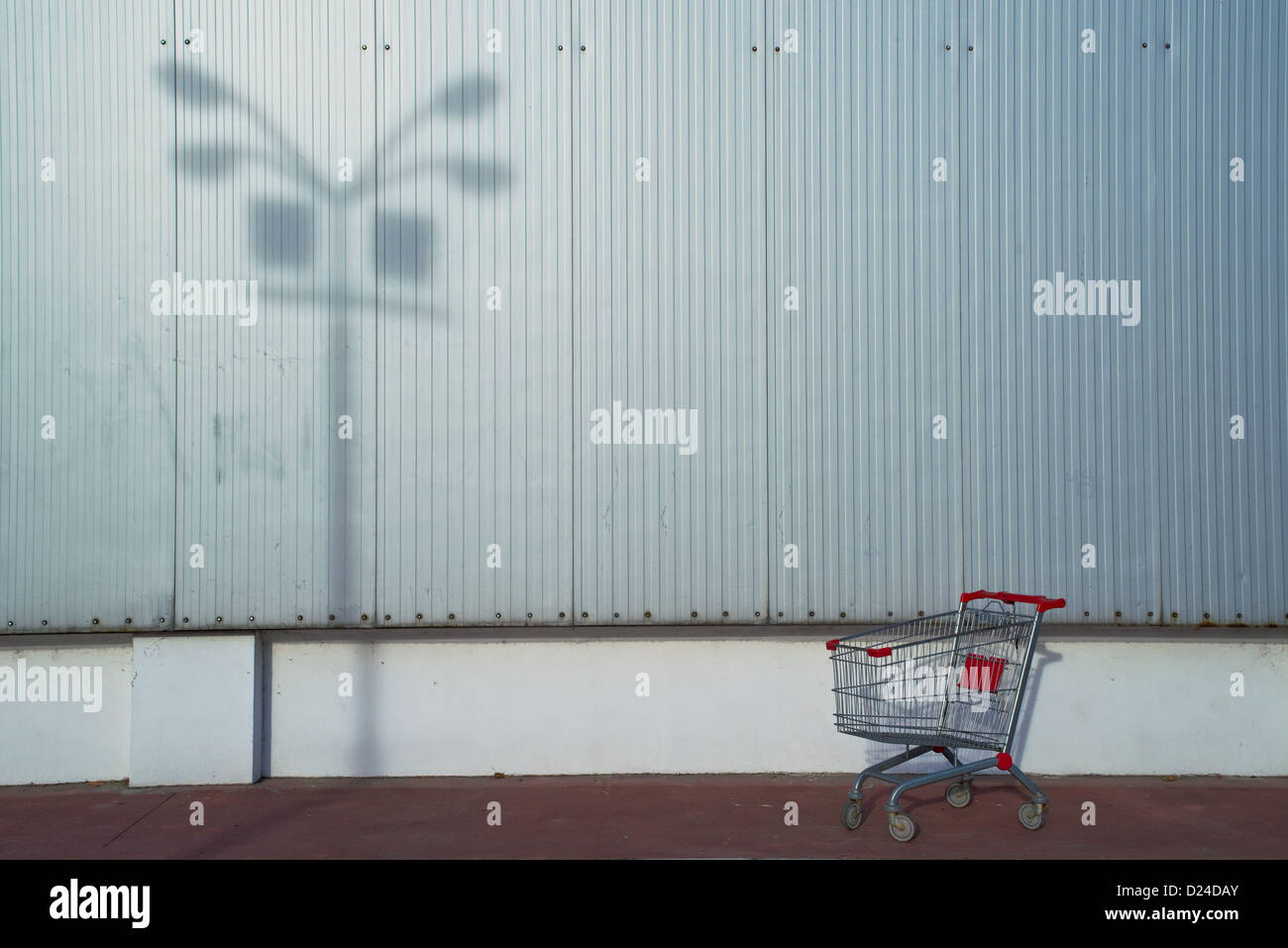 Empty shopping cart in front of the supermarket Stock Photo