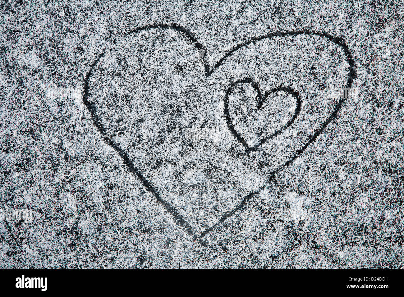 heart drawed on the icing on the ice Stock Photo