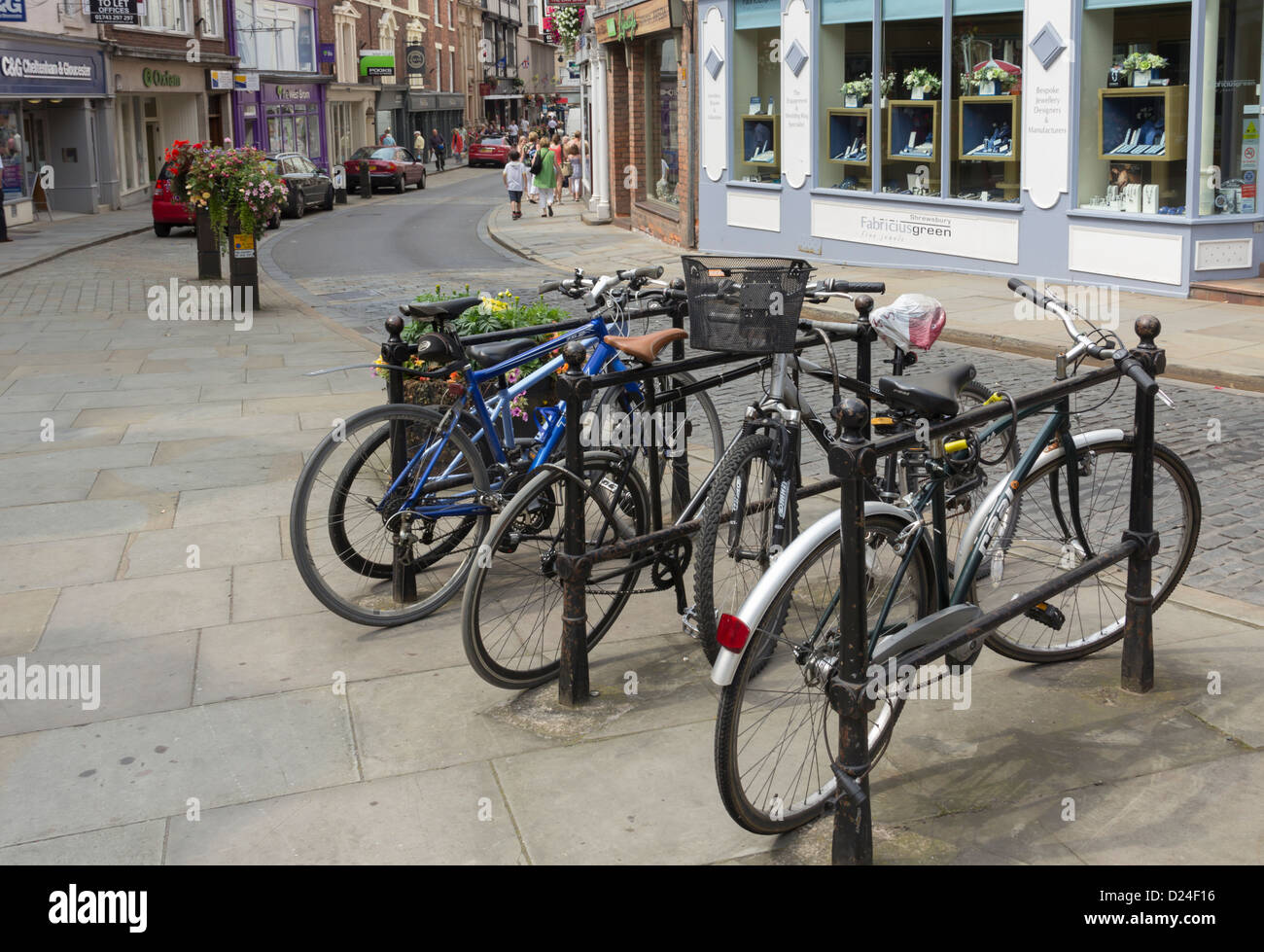 Bicycle stand in front of the Fabricus Green Fine Jewels shop on High Street Shrewsbury. Stock Photo
