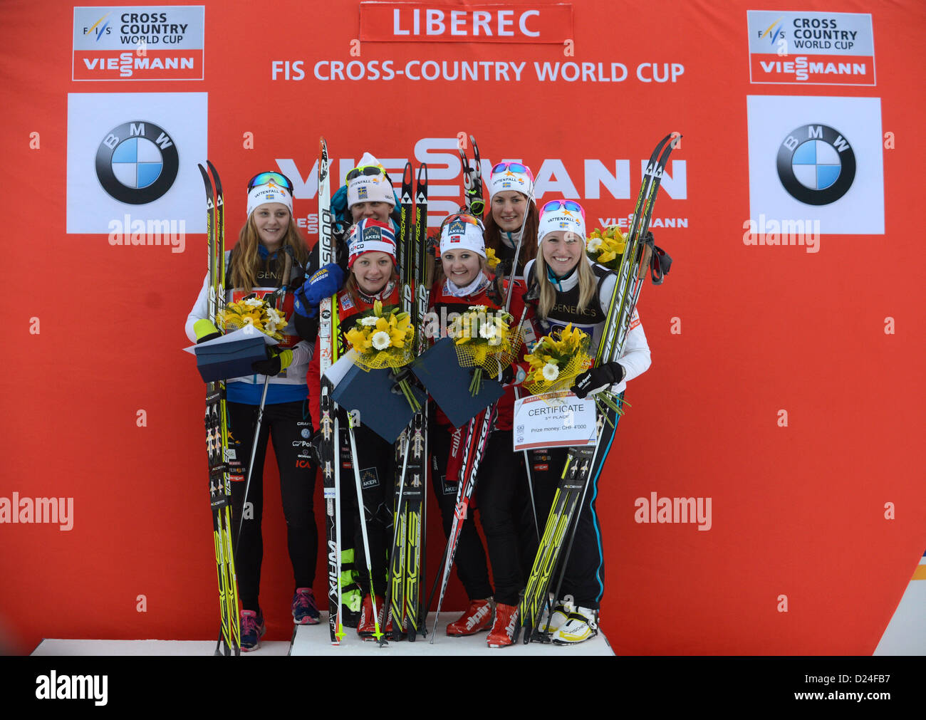 From left: second placed Stina Nilsson and Ida Ingemarsdotter from Sweden, first placed Norwegian skier Maiken Caspersen Falla and Ingvild Flugstad Ostberg, third placed Linn Somskar and Magdalena Pajala from Sweden are celebrating victory after the women´s team race of FIS Cross-Country Skiing World Cup 2012-13 in Liberec, Czech Republic, January 13, 2013. (CTK Photo/Michal Kamaryt) Stock Photo