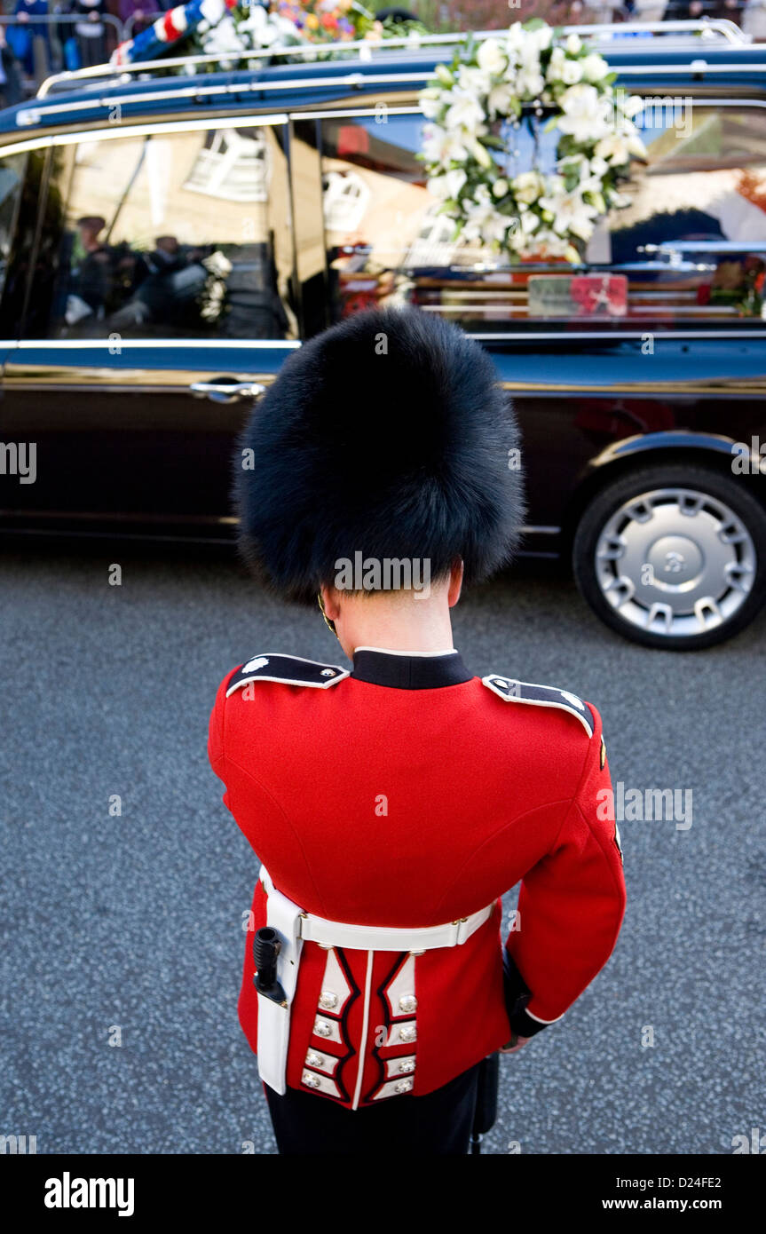 A British Guards soldier in formal dress at a military funeral in