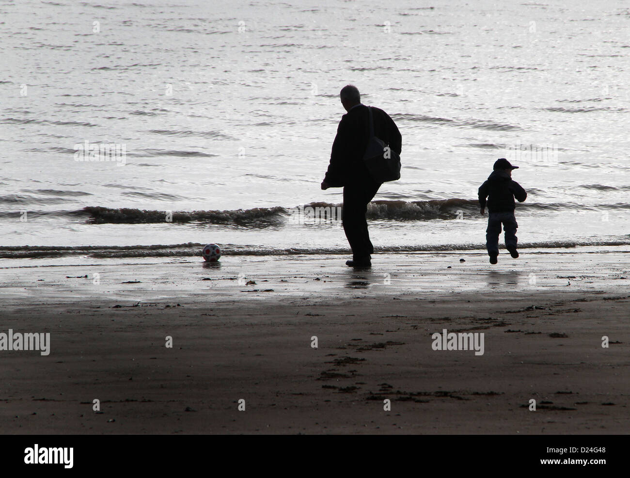 Silhouettes on the beach. Stock Photo