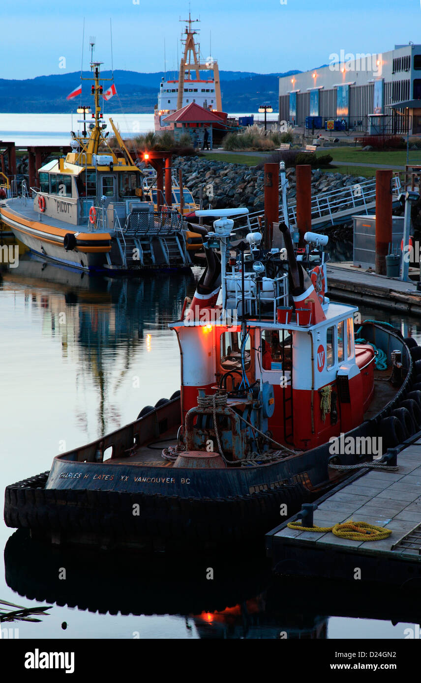 Pilot boat and coast guard boat at dusk in Victoria BC Canada Stock Photo