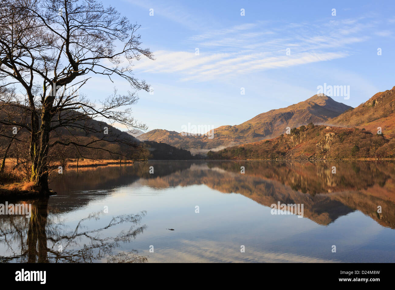 View to Yr Aran with reflections in still tranquil waters of Llyn Gwynant lake in mountains of Snowdonia National Park landscape. North Wales UK Stock Photo