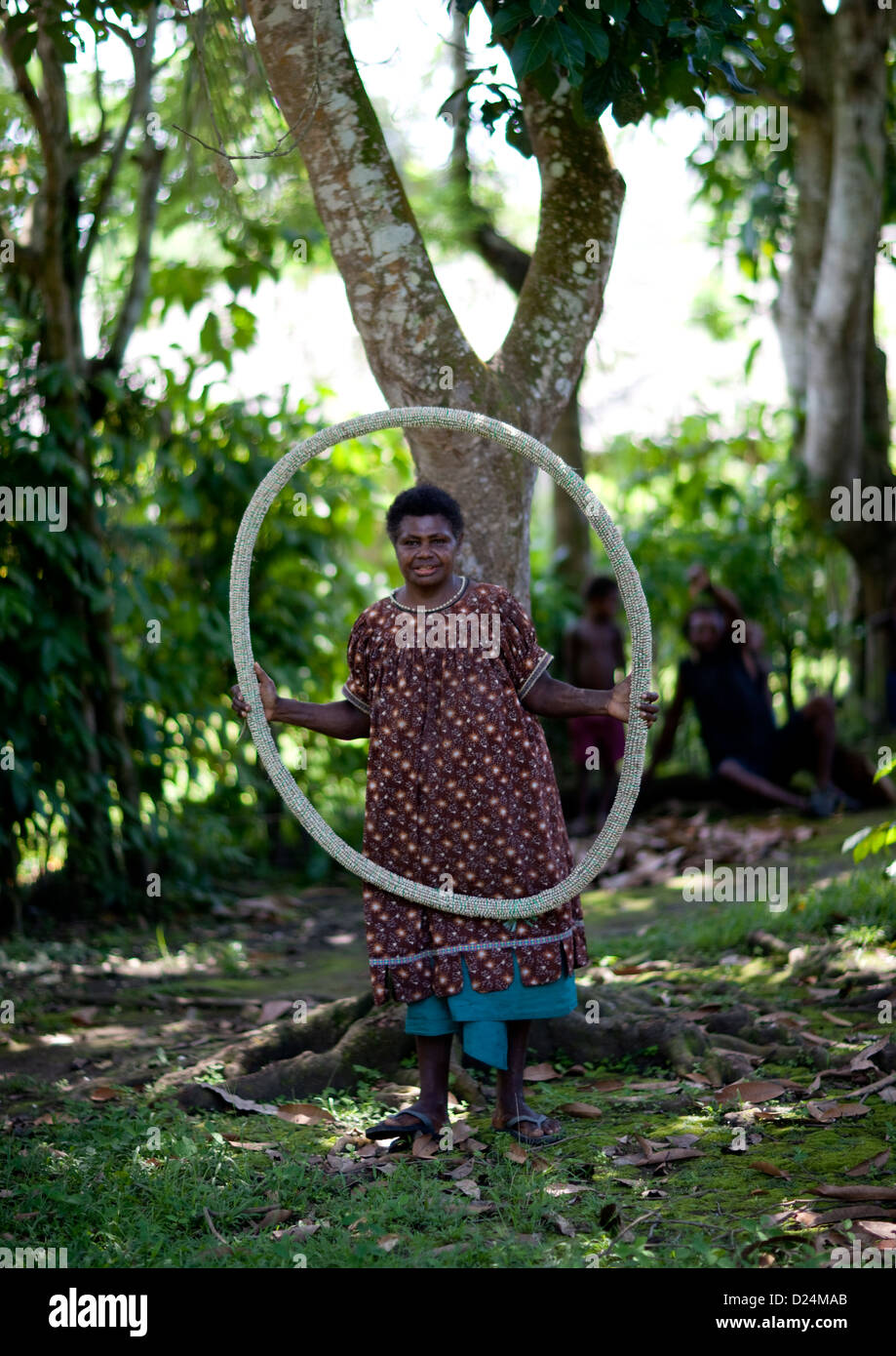Woman Holding A Giant Shell Money, East New Britain, Papua New Guinea Stock Photo