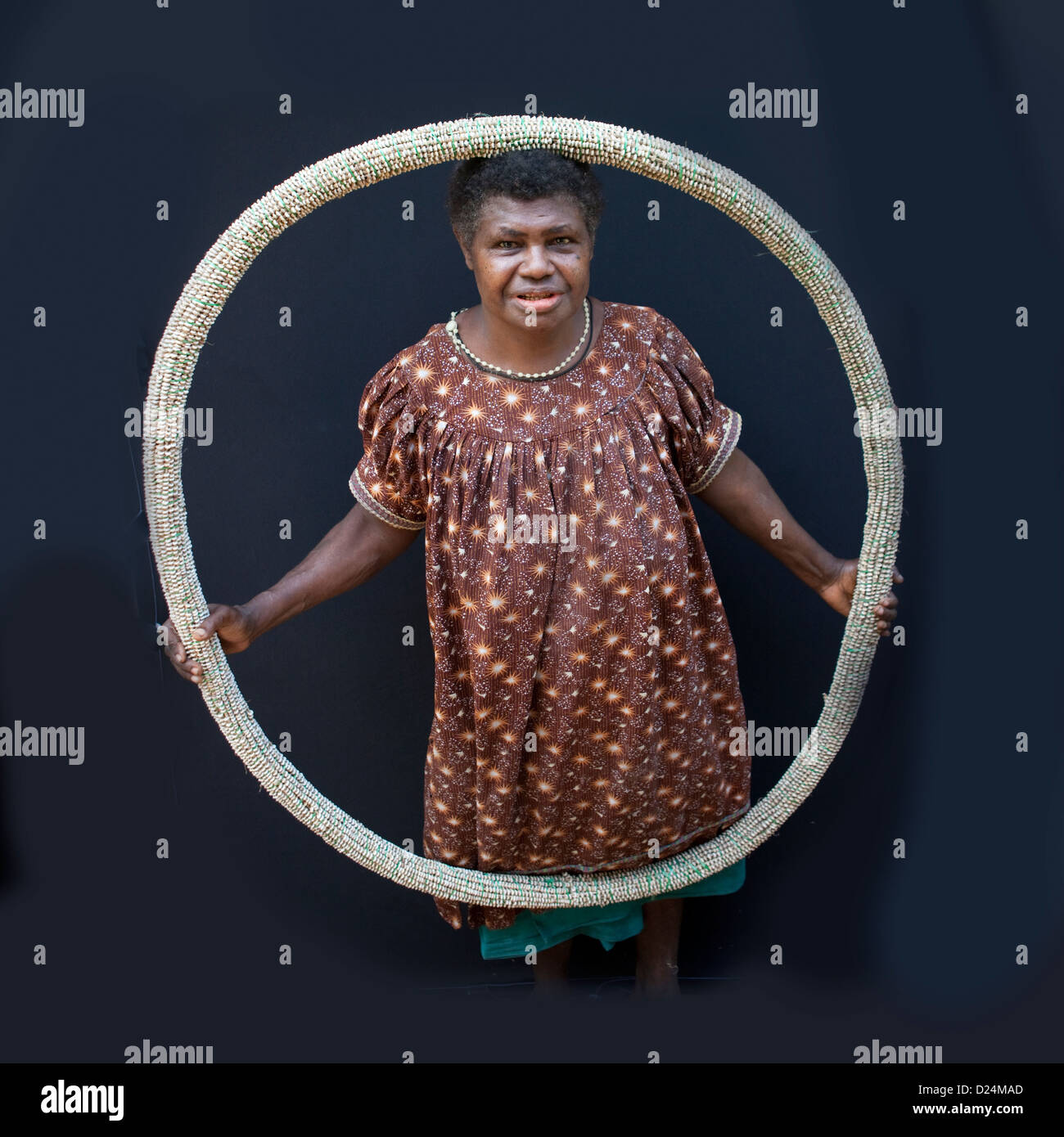 Woman Holding A Giant Shell Money, East New Britain, Papua New Guinea Stock Photo