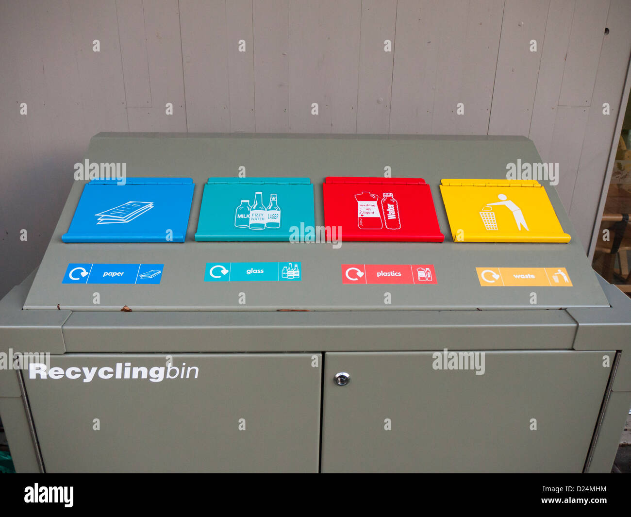 A recycling bin for paper, plastic and glass with a separate compartment for rubbish Stock Photo