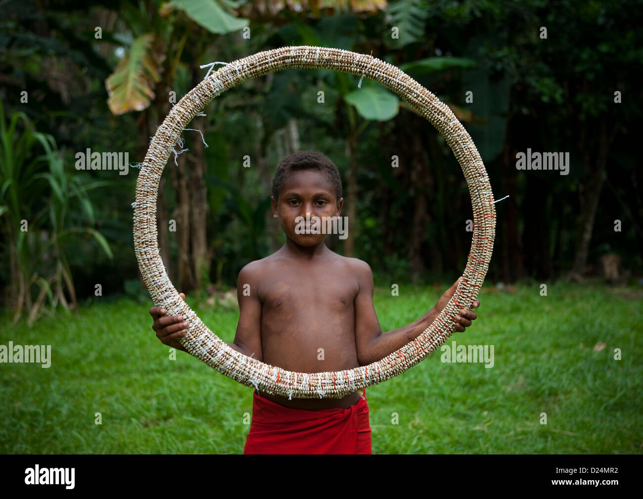 Boy Holding A Giant Shell Money, East New Britain, Papua New Guinea Stock Photo