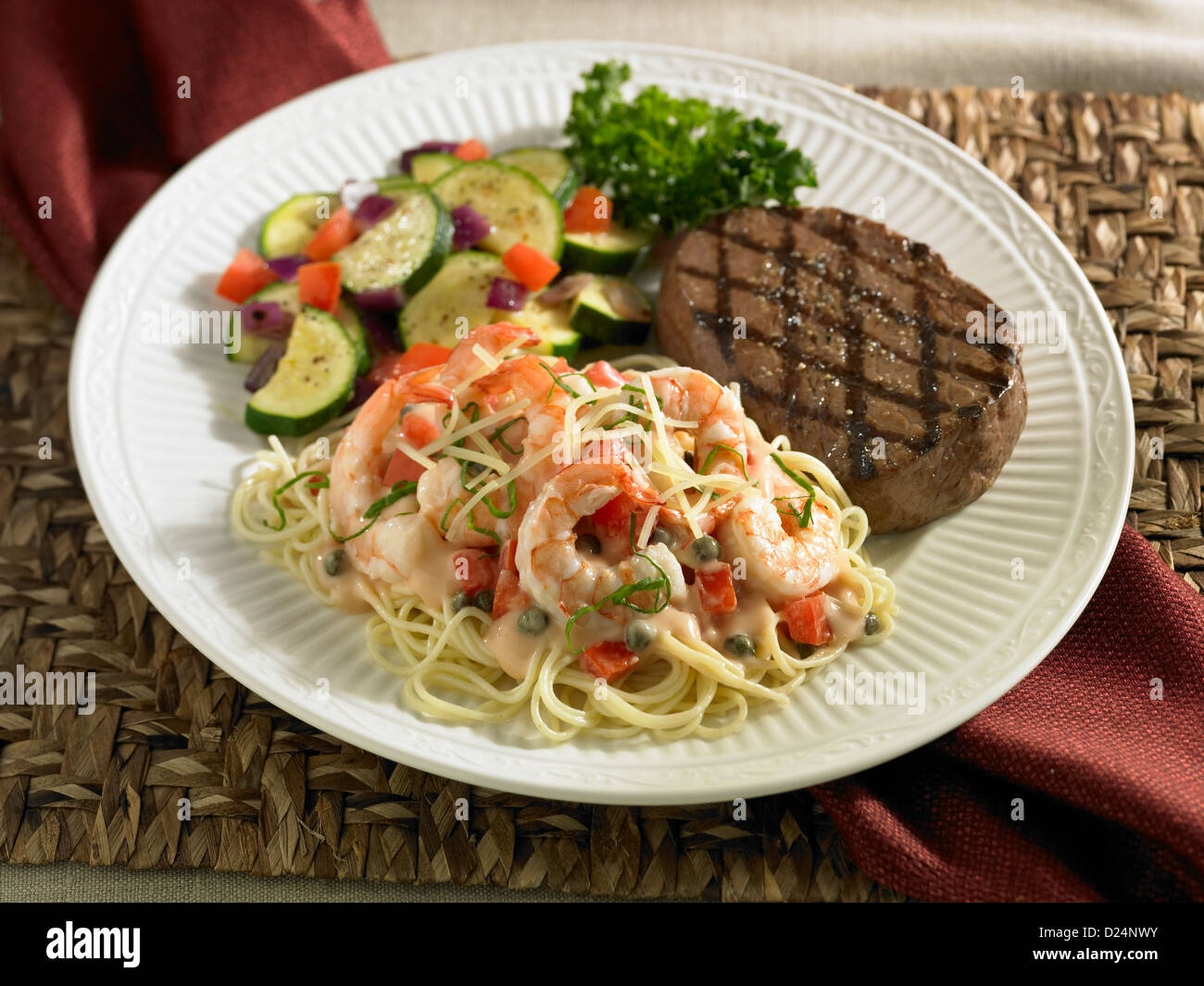 Steak and shrimp pasta dinner served with vegetables Stock Photo Alamy