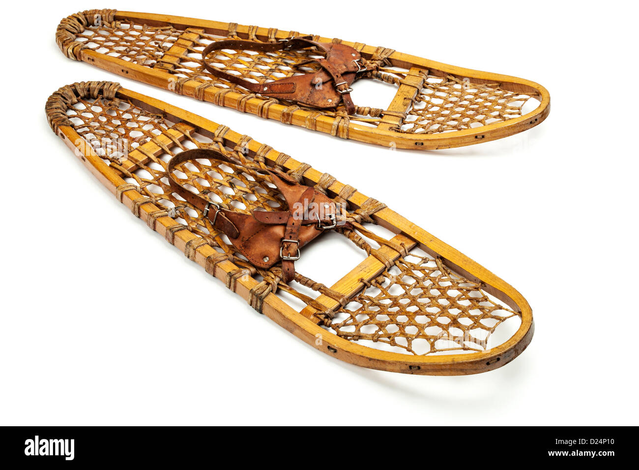 vintage wooden bear paw snowshoes with leather binding on white Stock Photo