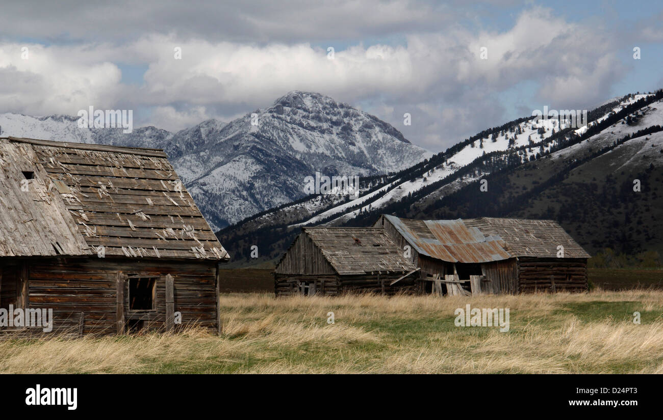 Mountains and Weathered old barn Rocky Mountains Montana storm cloud Stock Photo