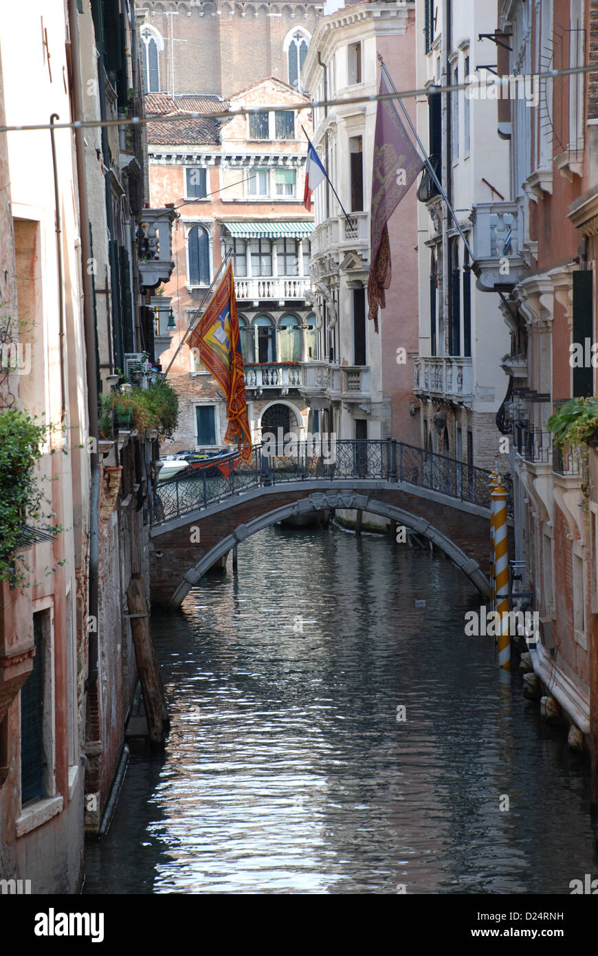 sleepy side Canal with bridge in Venice Stock Photo