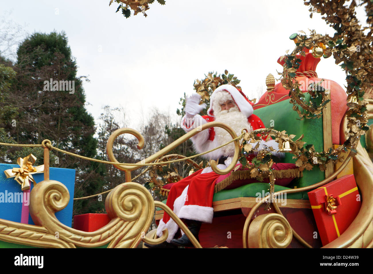 Father Christmas waving to visitors during a parade at Disneyland Paris, France. Stock Photo