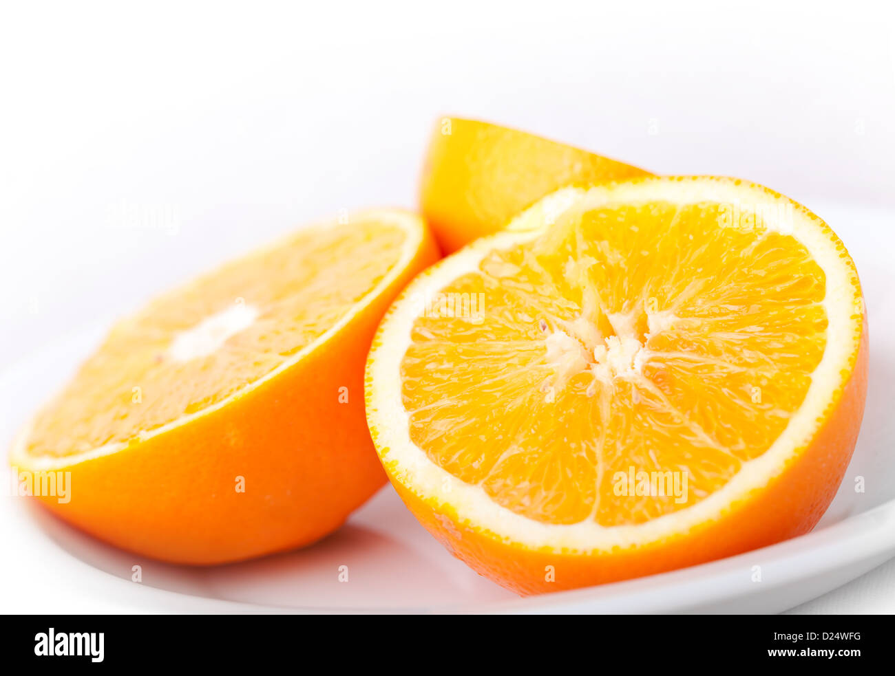 Sliced fresh orange fruit on white background Stock Photo