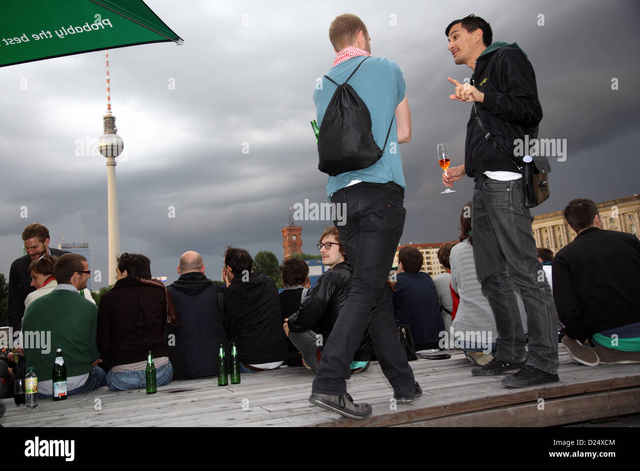 Berlin, Germany, attending a party, in the background of the TV tower Stock Photo
