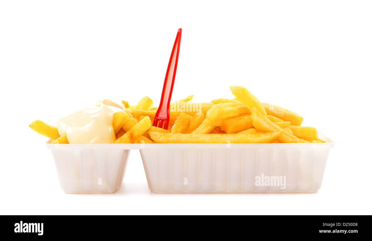 Portion of French fries with mayonnaise and plastic fork in disposable tray Stock Photo