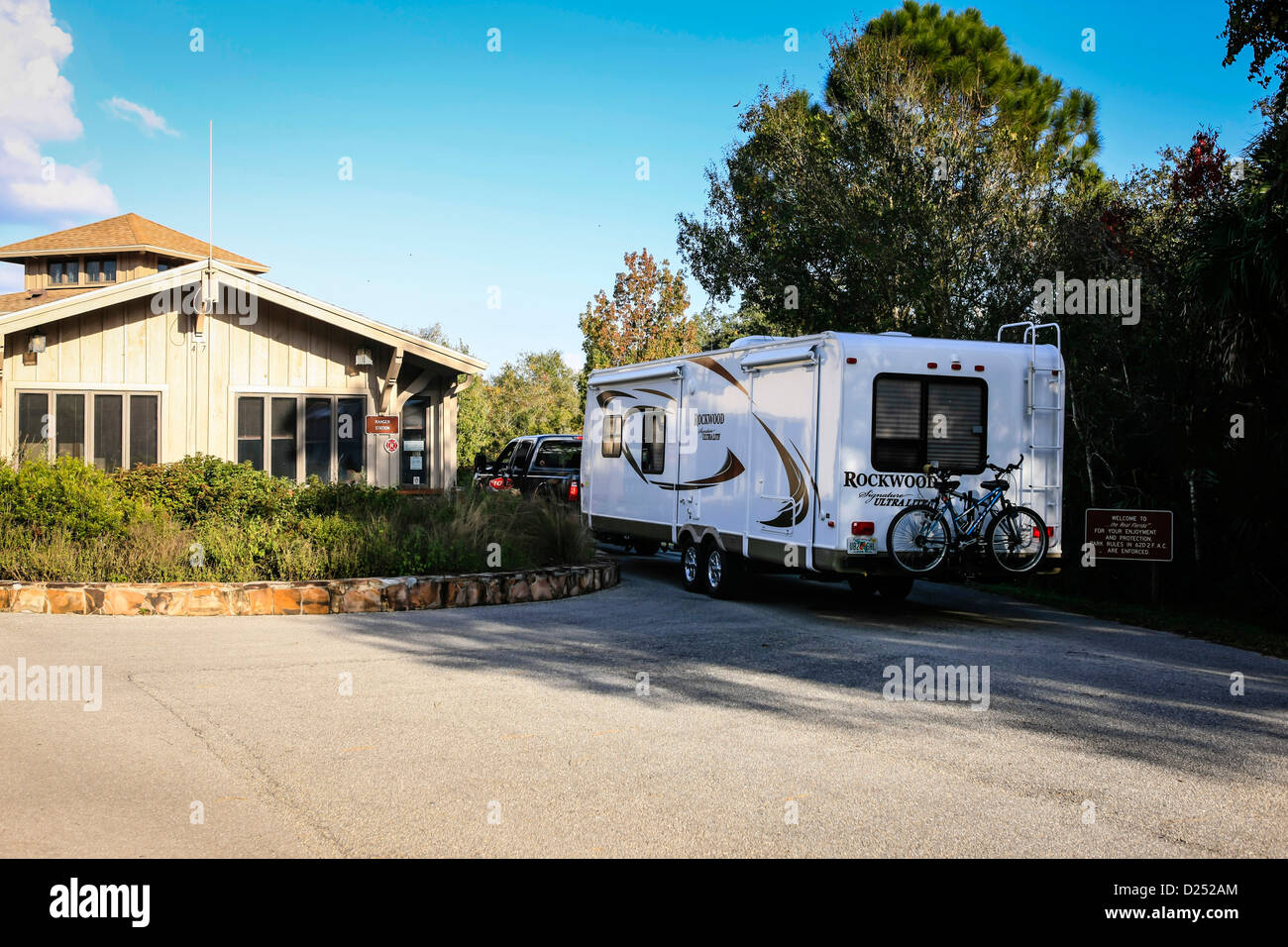 A fifth wheel enters the Myakka State Park campground during high season Stock Photo