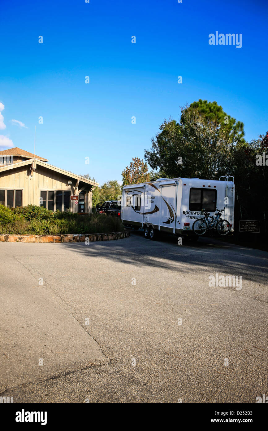 A fifth wheel enters the Myakka State Park campground during high season Stock Photo