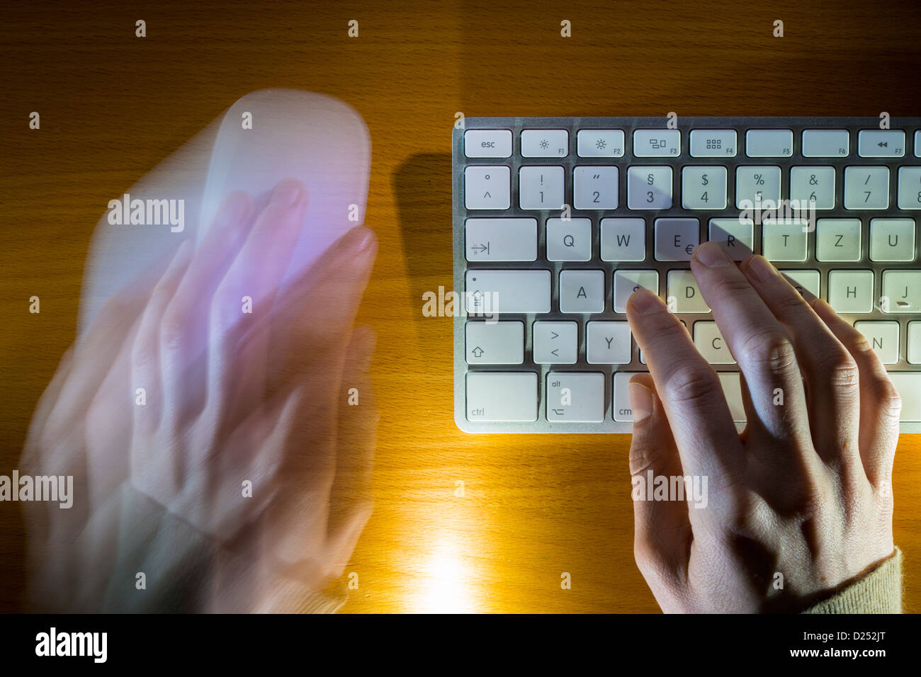 Person is working with a desktop computer. Using keyboard an mouse. Stock Photo