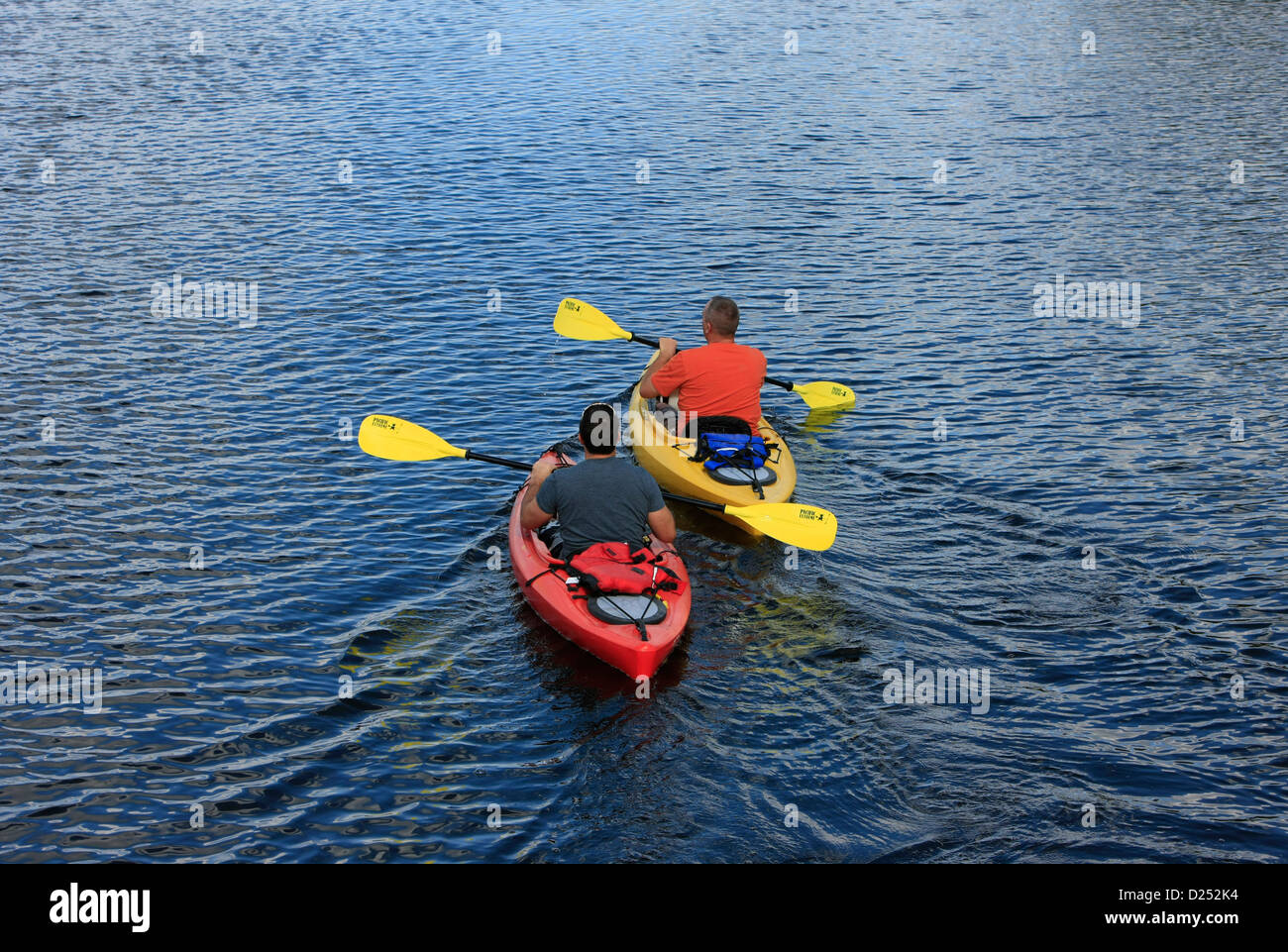 Two men kayaking on the Myakka River in Florida Stock Photo