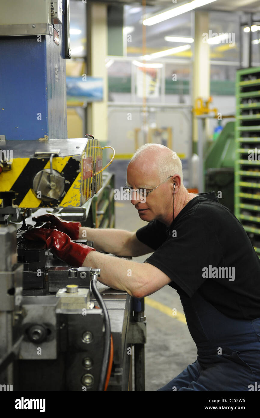 Schwyz, Switzerland, a man with a machine for making Victorinox pocket  knives Stock Photo - Alamy