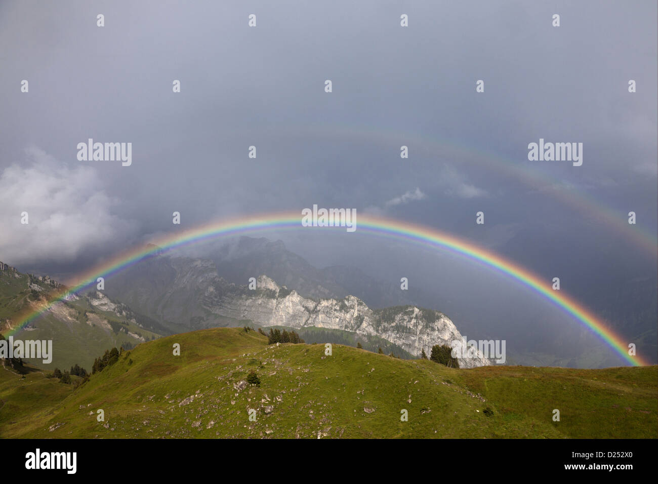View of double rainbow over mountain landscape, Schynige Platte, Bernese Oberland, Switzerland, August Stock Photo