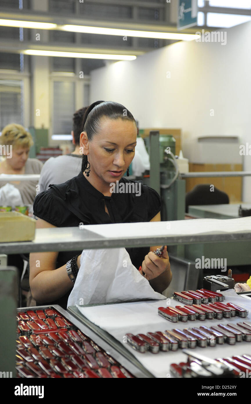 Schwyz, Switzerland, women in polishing finished Victorinox pocket knives Stock Photo