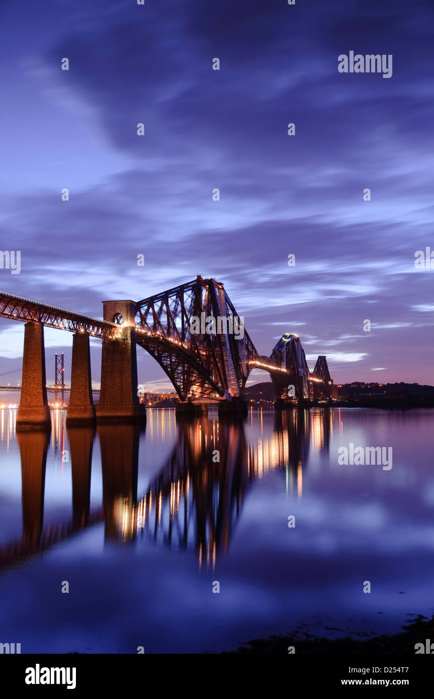 Beautiful view of the Forth Rail Bridge illuminated at night Stock Photo