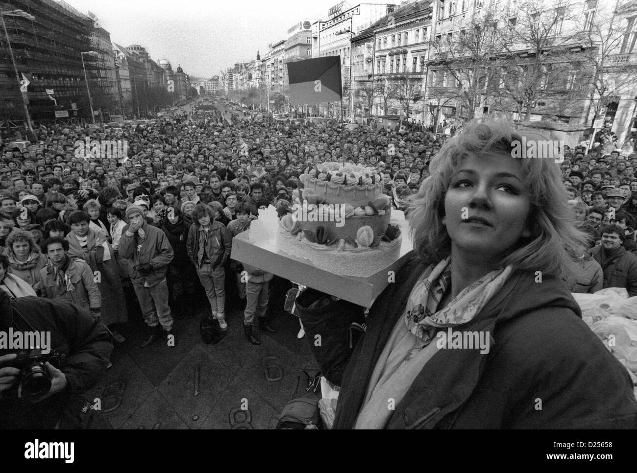 November 1989 Velvet Revolution. Student demonstrator holds a cake aloft in Wenceslas Square Stock Photo