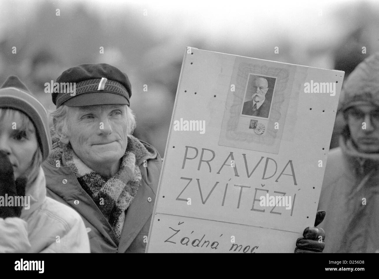 November 1989 Velvet Revolution. A demonstrator in the crowd holding a banner saying: 'Truth prevails.' Stock Photo