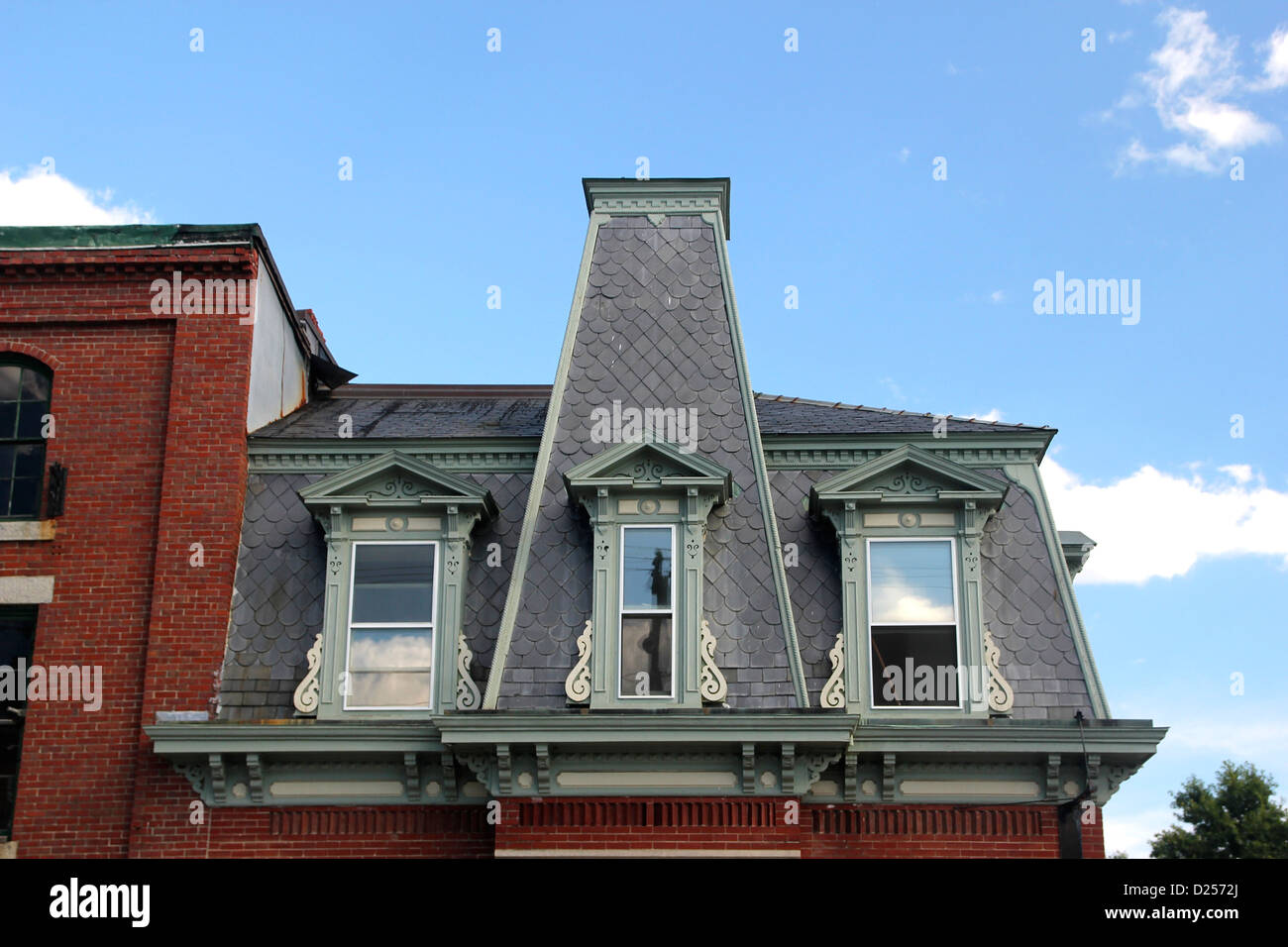 Detail of the ornate top storey and roof of a building in Searsport, Maine Stock Photo