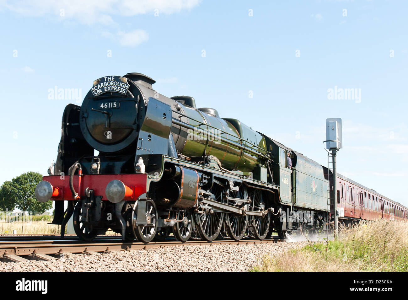 Steam pulling a passenger train through near York, England, UK on the mainline Stock