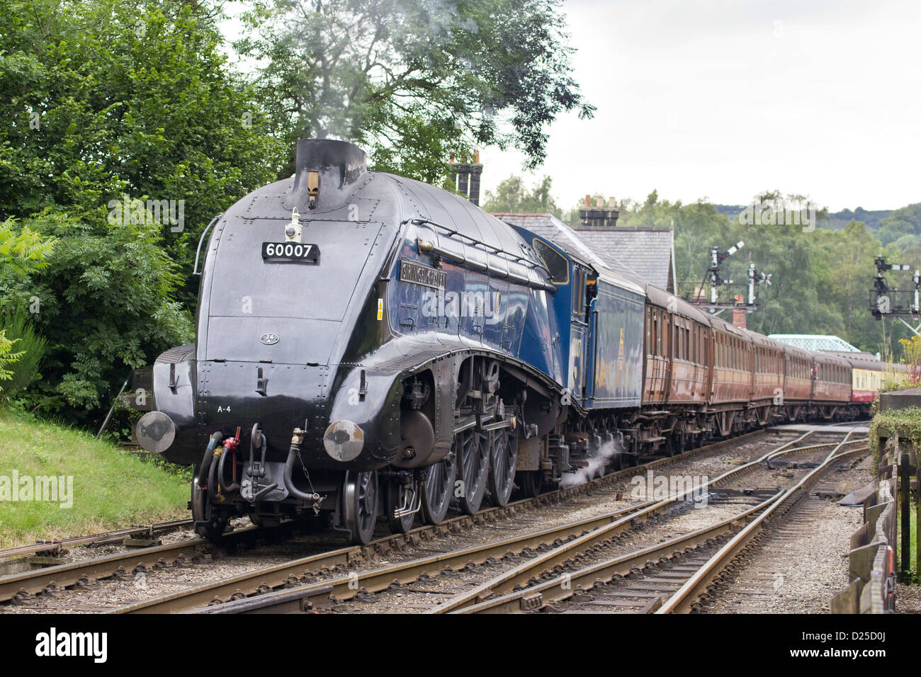 Steam locomotive pulling a passenger train on the North Yorkshire Moors Railway  at Grosmont Stock Photo