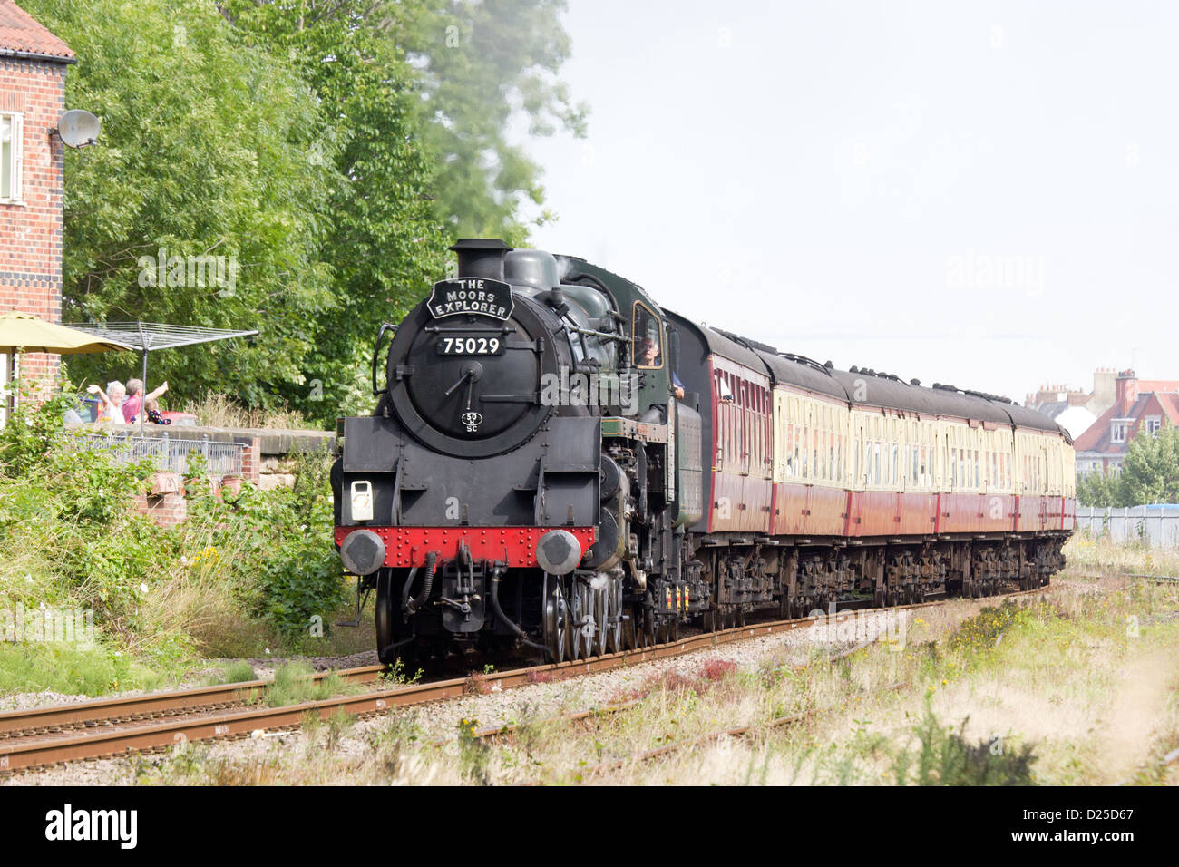 Steam locomotive pulling a passenger train on the North Yorkshire Moors Railway  at Whitby Stock Photo