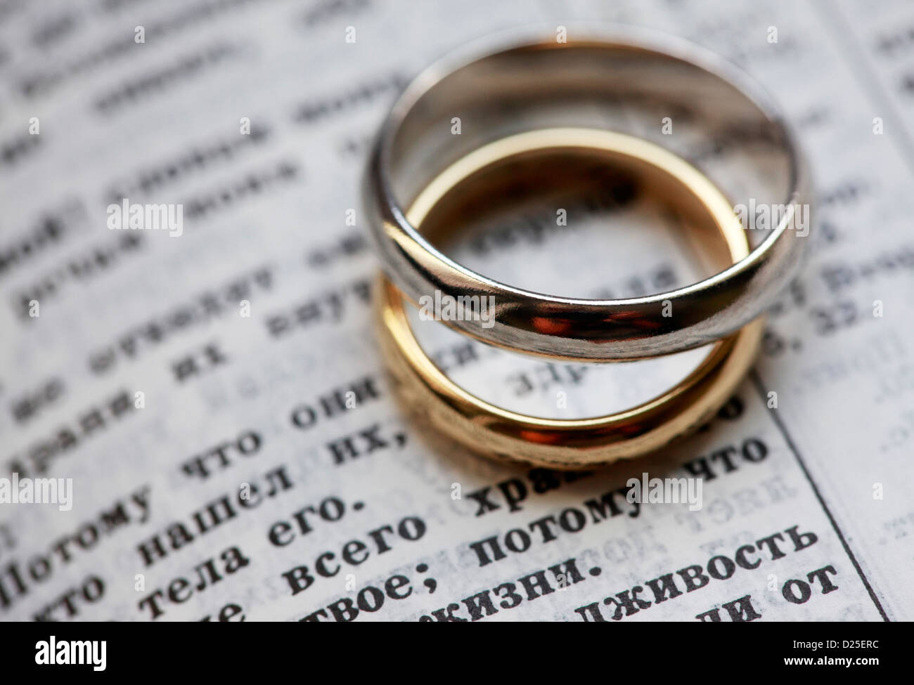 Wedding rings and the bible in Russian Stock Photo