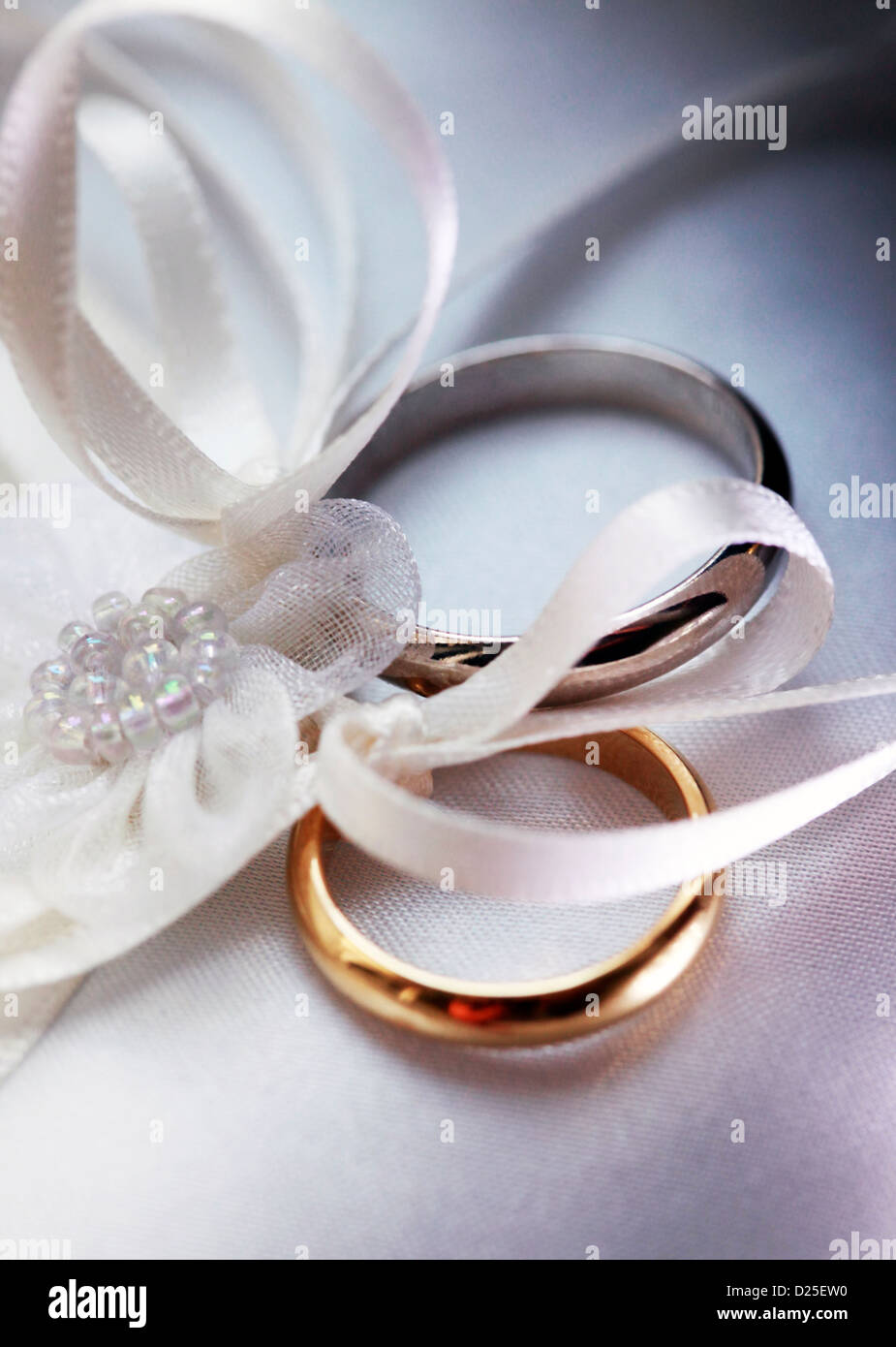 Wedding rings on a satiny fabric Stock Photo Alamy