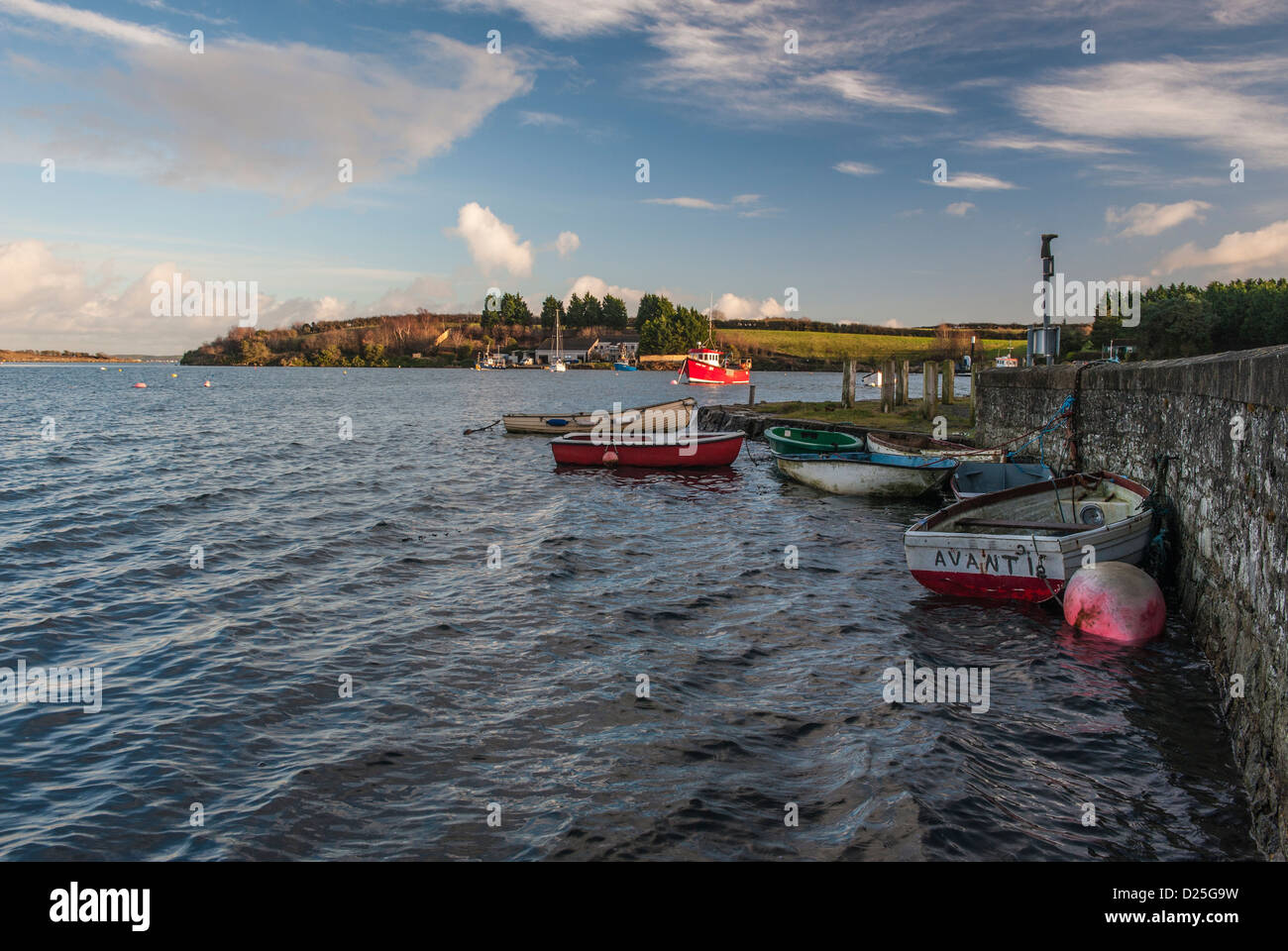 Small boats moored at water's edge at high tide.  Whiterock, Co Down, Northern Ireland. Stock Photo