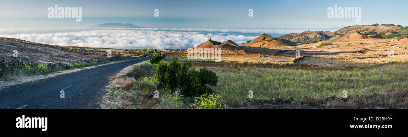 Dry farmland and volcanic cones on El Hierro, Canary Islands, with the islands of La Palma and La Gomera in the background Stock Photo