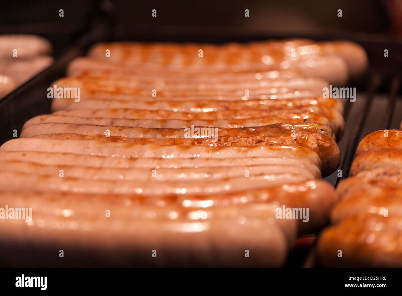 Sausages on a Schwenk grill Stock Photo Alamy