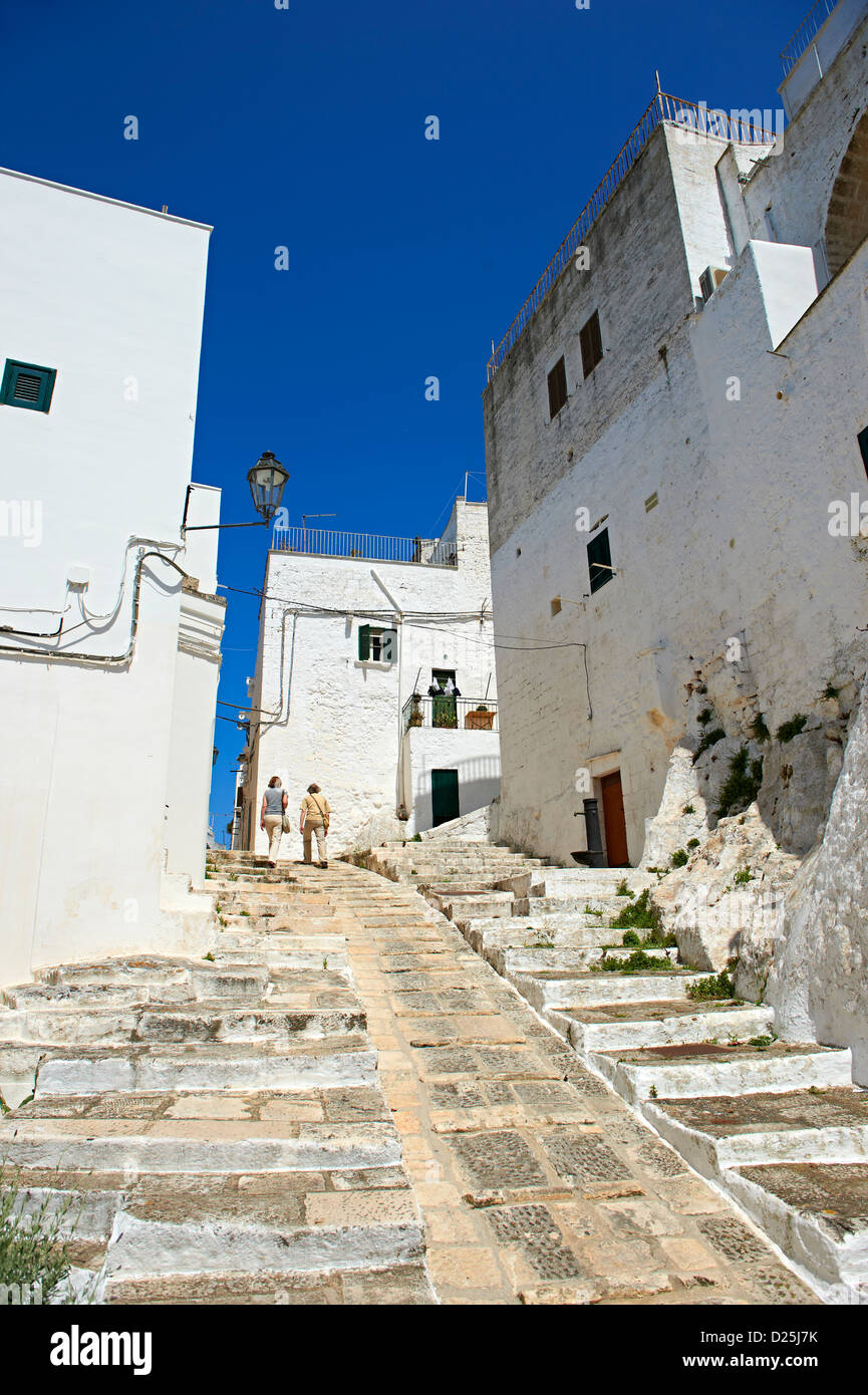 The medieval narrow streets of Ostuni, The White Town, Puglia, Italy. Stock Photo