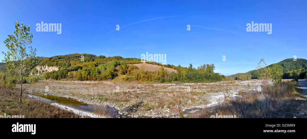 Reggio Emilia Apennines valley panorama with river and lonely house uphill Stock Photo