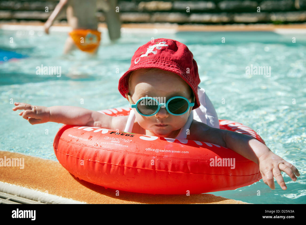 outdoors Exterior Outdoor Outside in water holidays Holiday Vacation Vacationing Vacations swimming pool 1 month to 1 year old Stock Photo