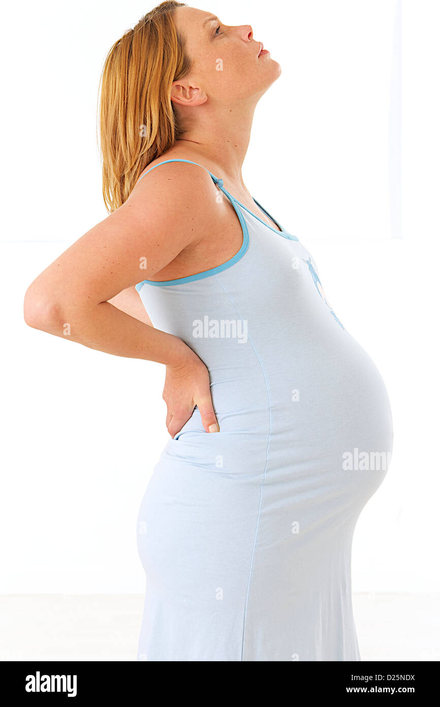 LOWER BACK PAIN, PREGNANT WOMAN Stock Photo Alamy